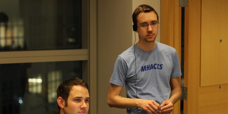 Photo of me with a radio earpiece in at MHacks